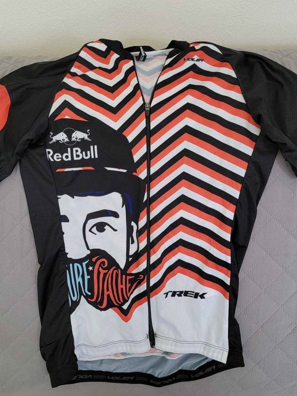 Red Bull Trek Women’s Cycling Jersey in Black, White & Orange